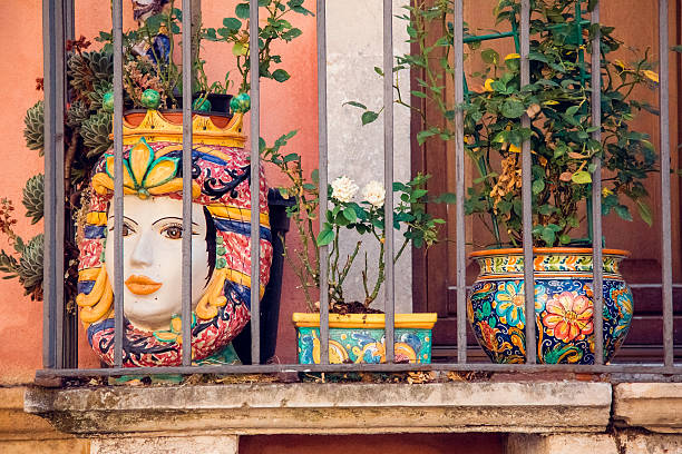 Woman face vase in Taormina town, Sicily, Italy stock photo