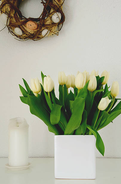istock Easter arrangement with an egg wreath and white tulips 507744004