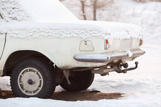 The rear of car trunk covered with snow in winter stock photo