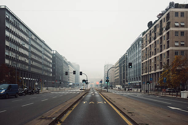 Street view of Milano Centrale railway station in a foggy stock photo