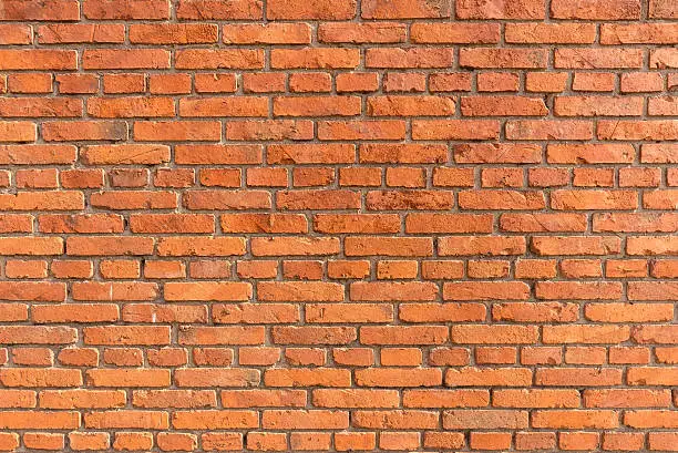 Photo of Orange brick wall background