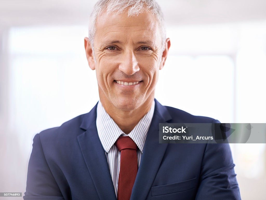 Loving his work Portrait of a smiling businessman pleased by company performance 40-49 Years Stock Photo