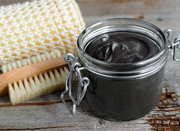 istock Black volcanic cosmetic clay in a glass jar 507746930