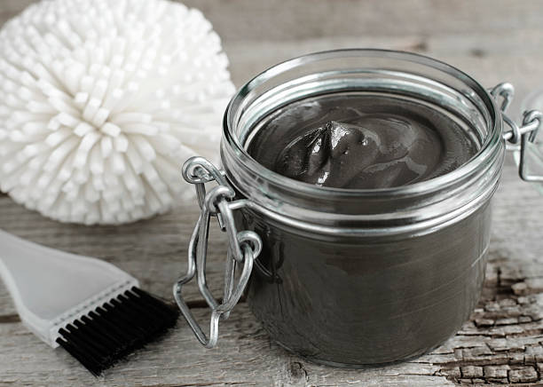istock Black volcanic cosmetic clay in a glass jar 507747024