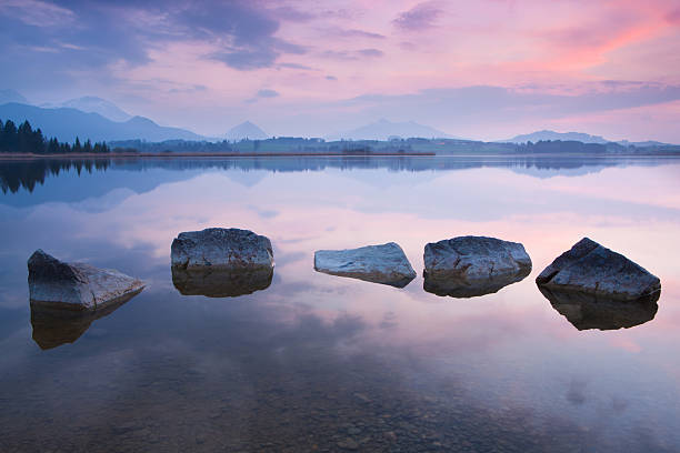 istock tranquil sunset at lake hopfensee, bavaria, allgaeu, germany 507747251
