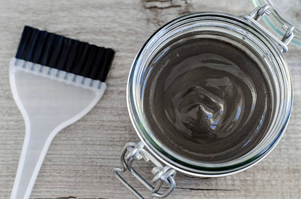 istock Black volcanic cosmetic clay in a glass jar 507747410