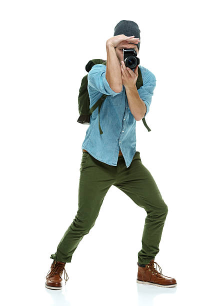 istock Photographer in action with camera 507747739