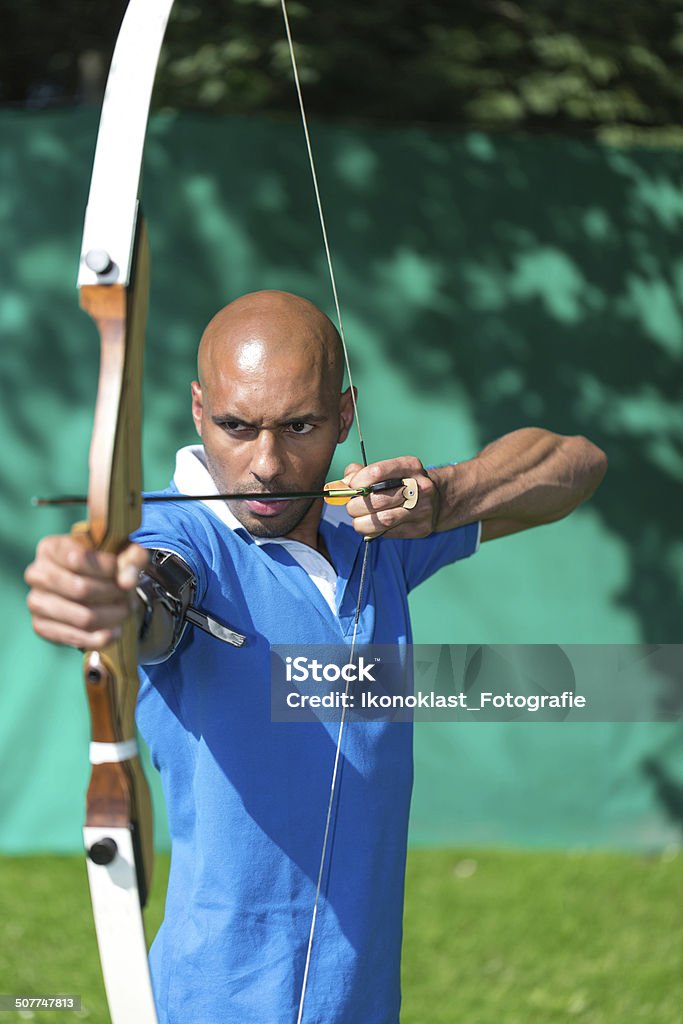 archer at shoots range with bow and arrow archer at shooting range with bow and arrow Accuracy Stock Photo