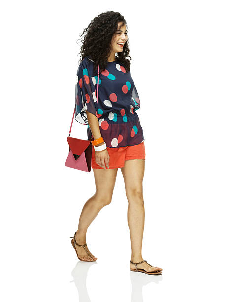 istock Cheerful woman walking & looking away 507747877