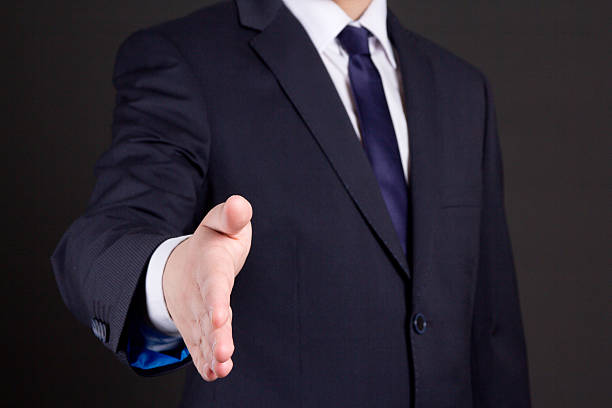 istock business man with open hand ready to handshake 507748100