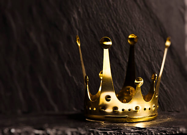 istock Golden crown with dark background 507748204