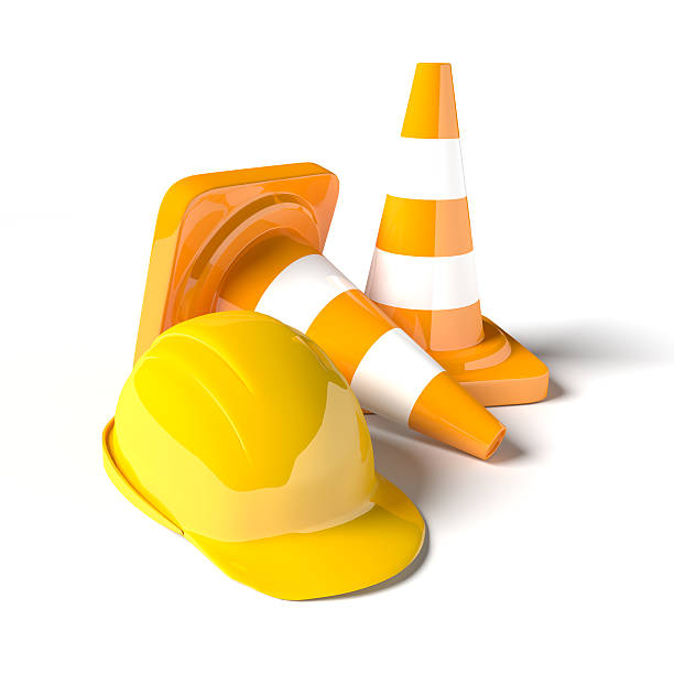 istock Traffic cones with work helmet isolated on the white. 507748360
