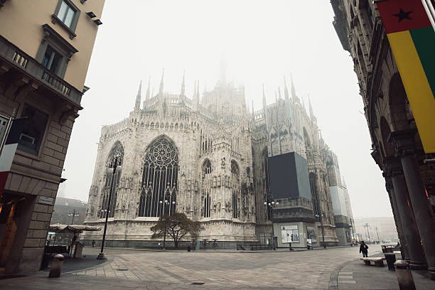 View of the Milan Cathedral with fog stock photo