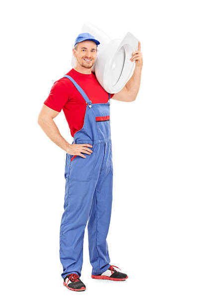 istock Plumber carrying a toilet bowl 507750567