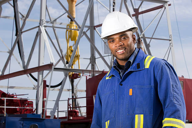 Oil Worker at a Rig stock photo