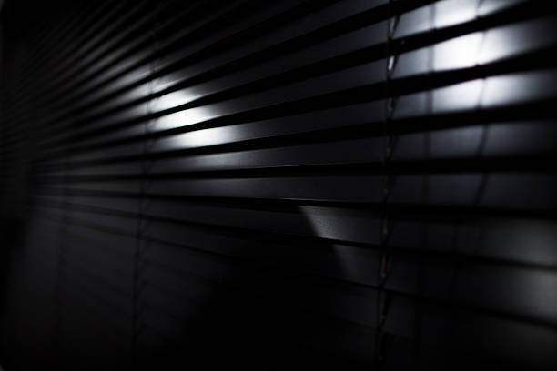 dark blinds night dark blinds background highlighted dark window blinds stock pictures, royalty-free photos & images