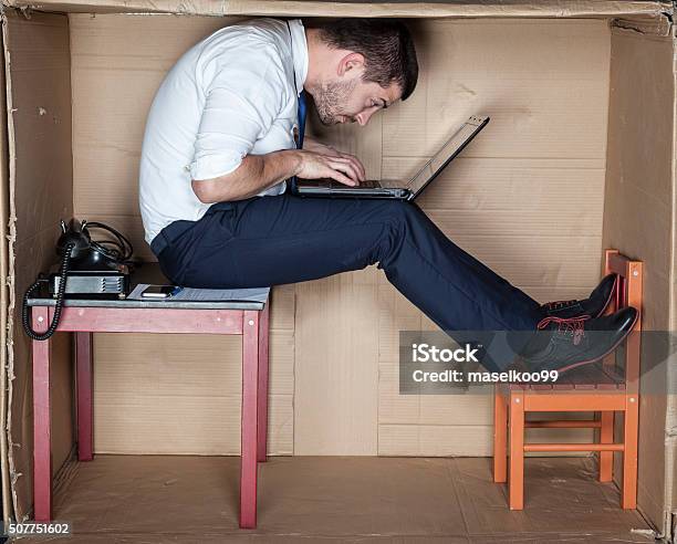 Businessman In A Strange Position Stock Photo - Download Image Now - Too Small, Large, Small
