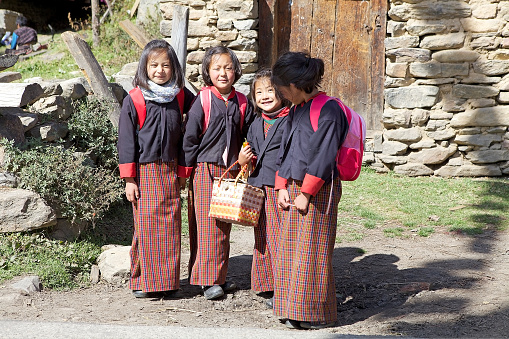 Chhume, Bhutan - November 9, 2015: Bhutanese students with traditonal clothes in the Chhume village, Bhutan. Western style education was introduced in Bhutan during the reign of Ugyen Wangchuck (1907-1926).