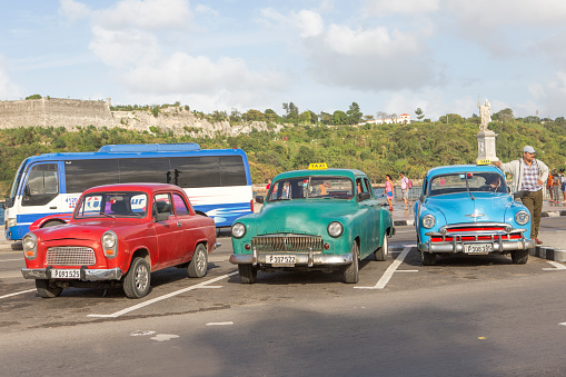 havana, Сuba - January 17, 2016: old historical american cars are parked with their drivers at street of havana cuba