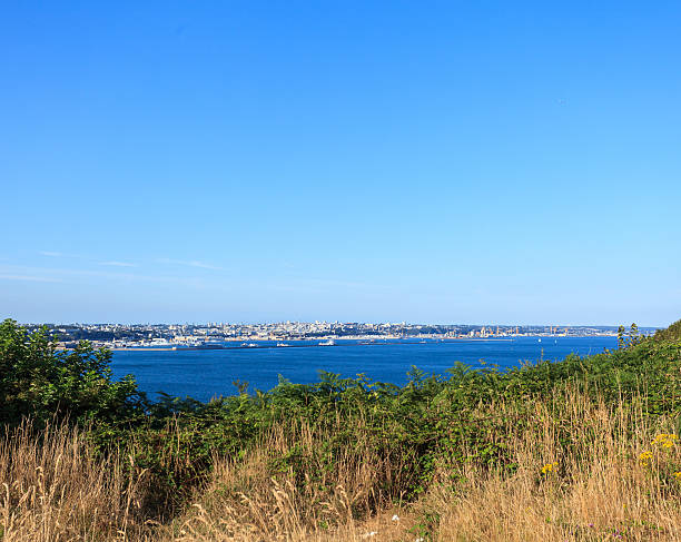 City of Brest, Brittany France from pointe des Espagnols Brest city oceanfront, Bretagne - France from pointe des Espagnols with blue sky on a summer day. brest brittany photos stock pictures, royalty-free photos & images