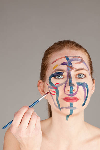 istock Woman Painting Her Face 507753656