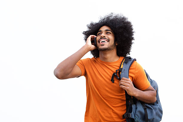 istock Happy travel guy talking on mobile phone 507754288