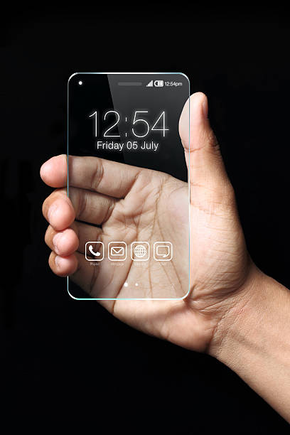 istock Transparent smartphone with hand on black background 507757396
