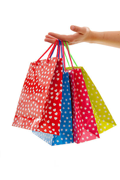 istock Hand is holding colorful shopping bags 507760568