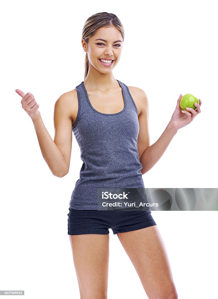 Anything is possible If you exercise and eat healthy Portrait of a sporty young woman holding an apple and showing thumbs up 20-29 Years Stock Photo