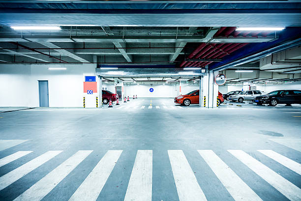 istock Parking garage, underground interior with a few parked cars 507773269