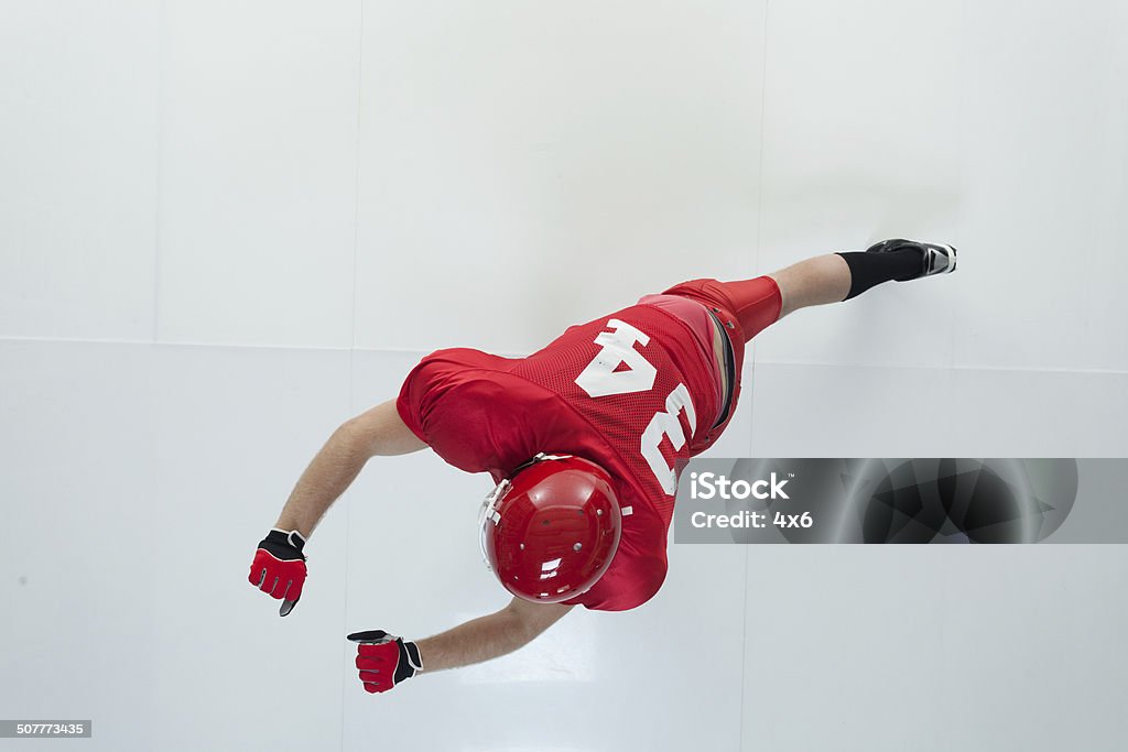 Above view of American football player blocking Above view of American football player blockinghttp://www.twodozendesign.info/i/1.png 20-29 Years Stock Photo