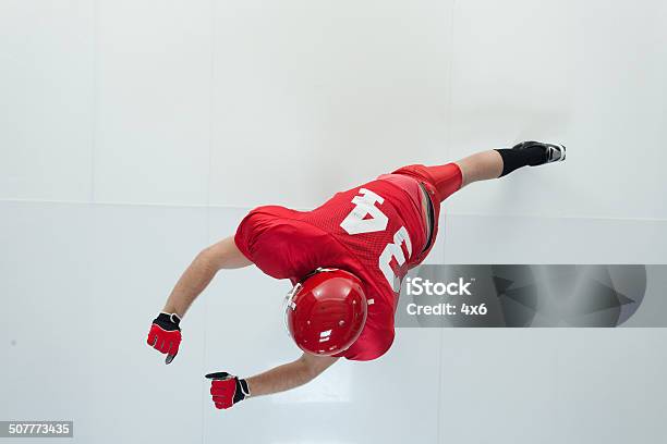 Above View Of American Football Player Blocking Stock Photo - Download Image Now - 20-29 Years, Activity, Adult