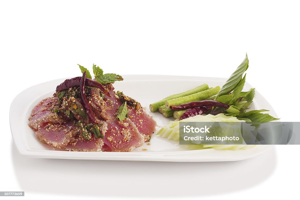 spicy fresh tuna tataki spicy fresh tuna tataki thai style with vegetable isolated on white. Bluefin Tuna Stock Photo