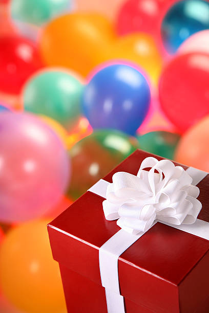 istock Birthday Present Surrounded by Balloons 507773999