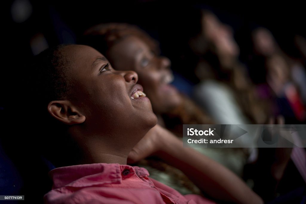 Happy people at the cinema Happy people at the cinema watching a movie Movie Theater Stock Photo