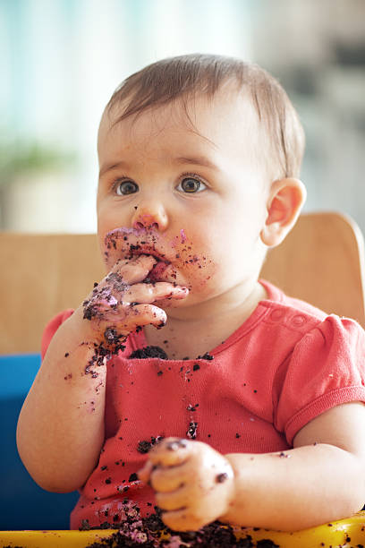 Baby eating a chocolate's cupcake
