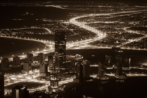 Dubai, UAE - January 2, 2015: Dubai downtown night scene with city lights. Top view from above