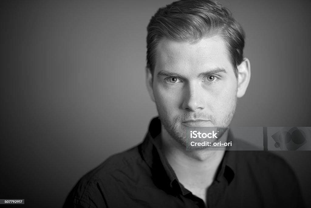 Portrait of a man Studio Portrait of a handsome man looking to the camera in Black and White Adult Stock Photo