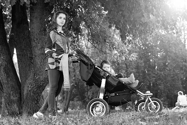 istock walk women with stroller summer sunlight 507792956
