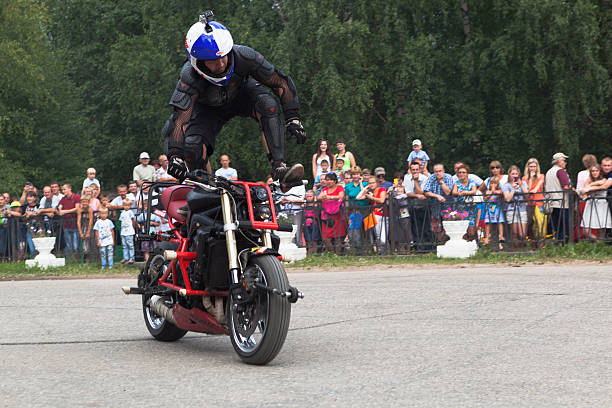 Saint Petersburg. Russia. September 26. 2020.A biker festival is taking place. a biker demonstrates difficult and dangerous stunts on his motorcycle.This underlines his mastery of technique.