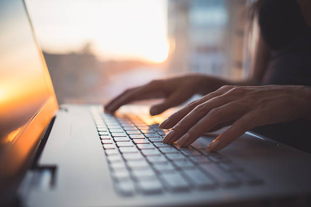 istock Woman working at home office hand on keyboard close up 507794036
