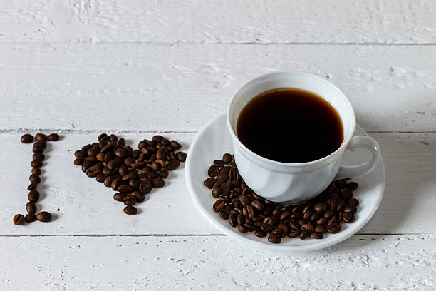 istock Coffee cup and saucer on a white wooden table 507804298