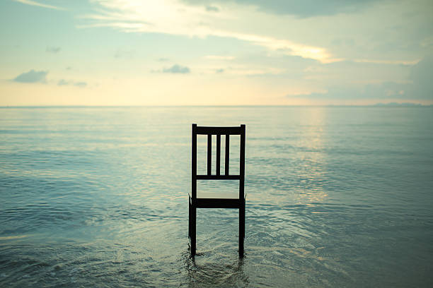 istock Chair on the beach with sunset. 507817561
