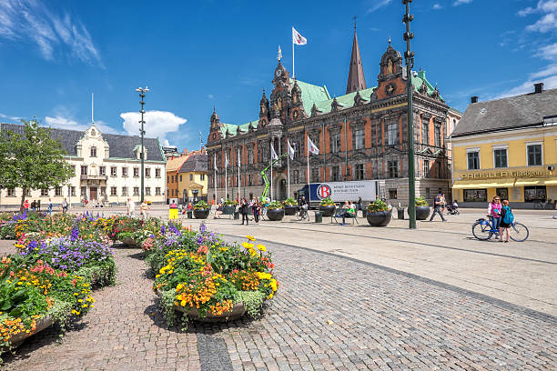 Malmo in Sweden Malmo, Sweden – July 2, 2014: People stroll the big square in front of the old city hall in Malmo on a sunny summer day. The square in Sweden’s third largest city dates back to the 16th century and is a popular tourist attraction. stortorget photos stock pictures, royalty-free photos & images