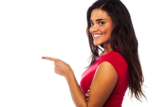 istock Pretty charming girl pointing away 507819291