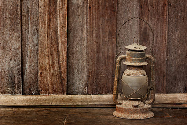 istock Old lantern on wooden background 507819327