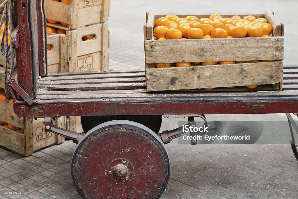 Produce Dolly at the Farmers' Market An almost empty wooden dolly sits at the Municipal Market in Sao Paulo, Brazil. Agricultural Equipment Stock Photo