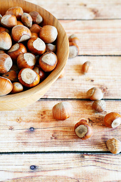istock Hazelnuts in wooden bowl 507822641