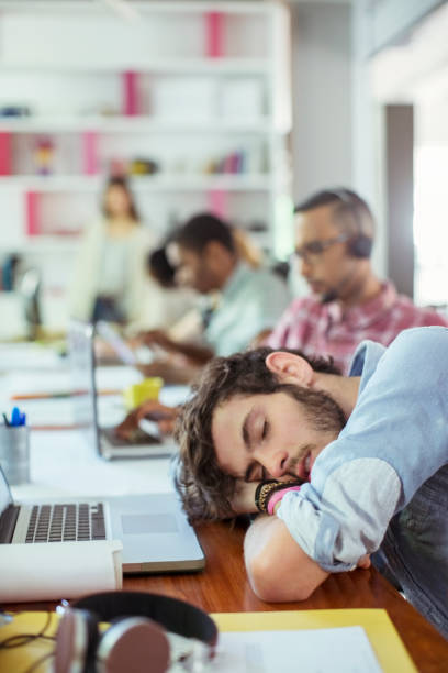 istock Man sleeping at desk in office 507831929