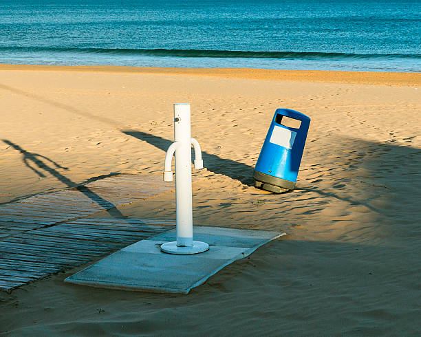 istock Trash can on the beach close to the shower 507832014